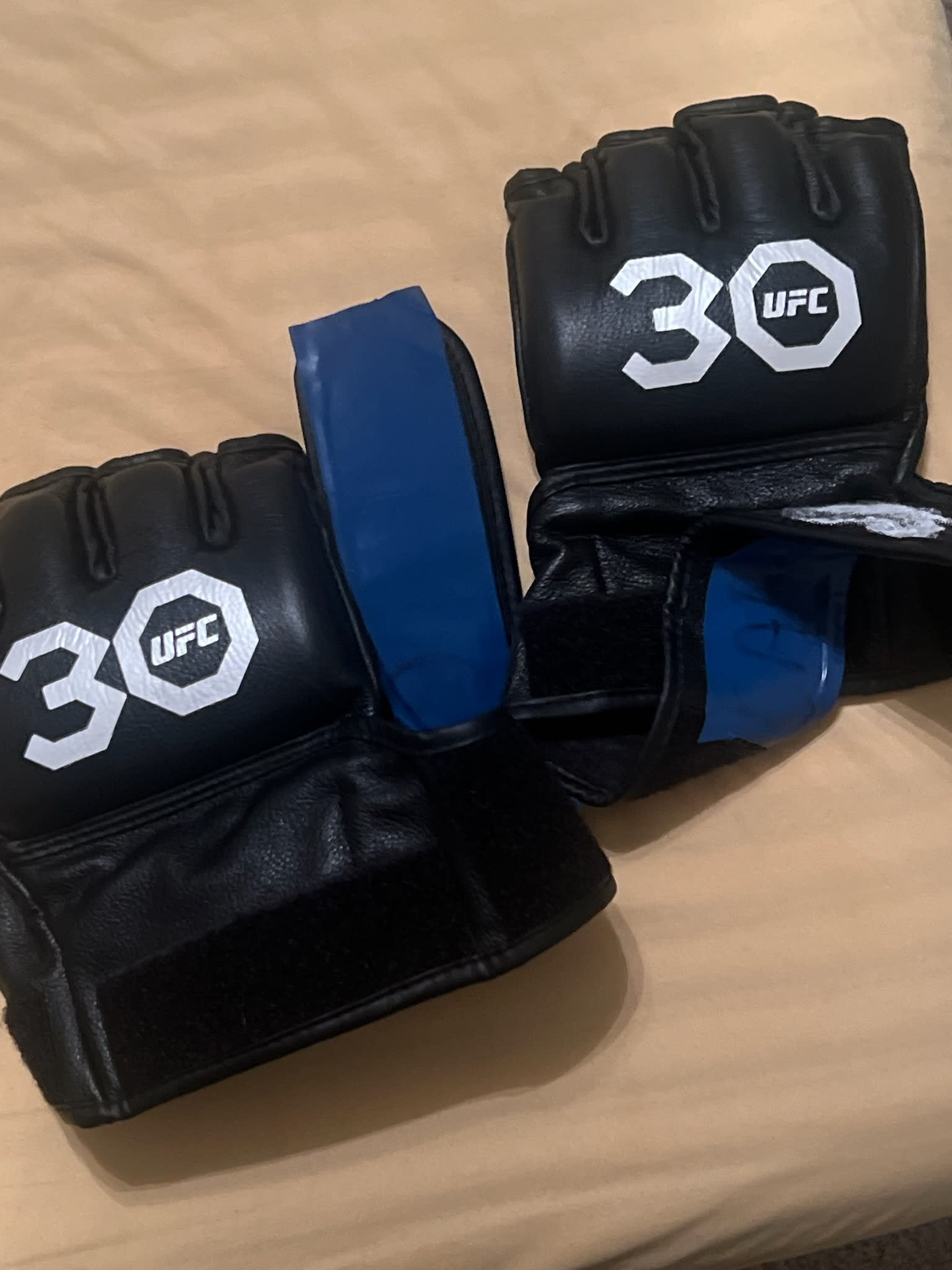 Terrance McKinney Autographed Fight-Worn 30th Anniversary UFC Gloves